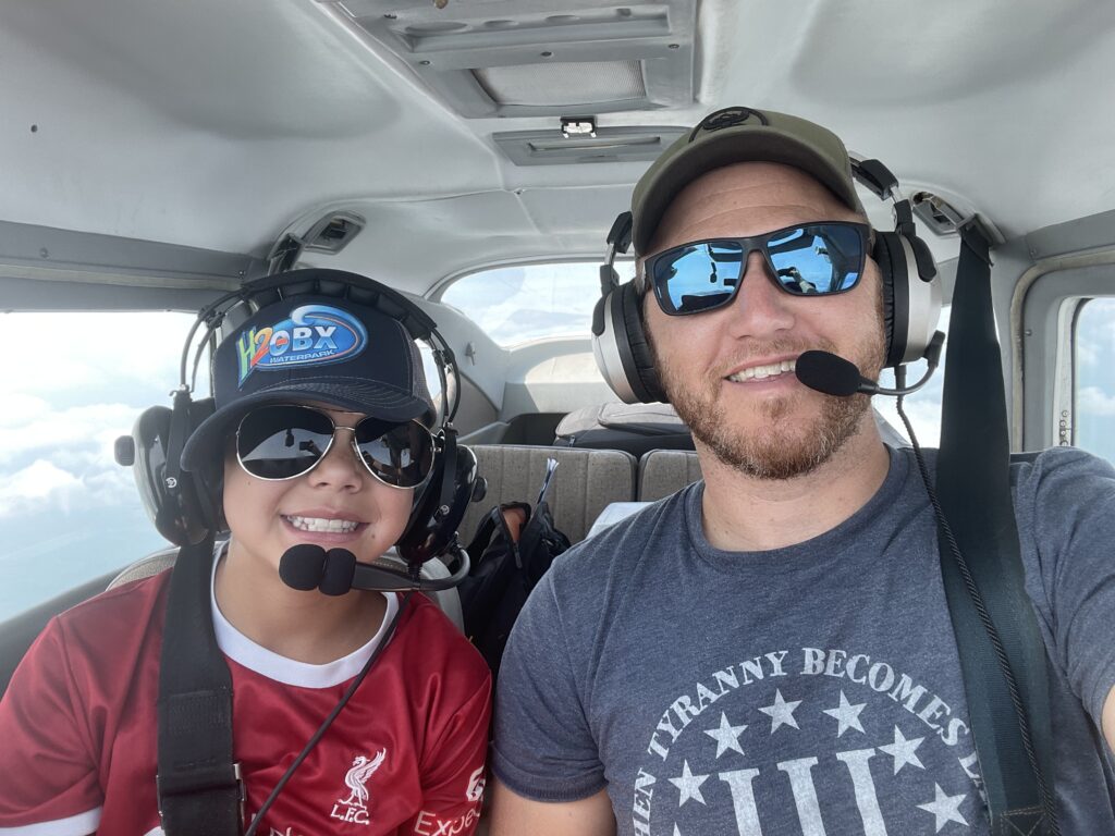 IMG_6259 Pilot and passenger smiling with headsets on