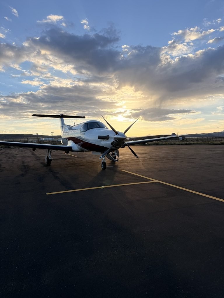 Pilatus PC-12 NG turboprop on the ramp at sunset
